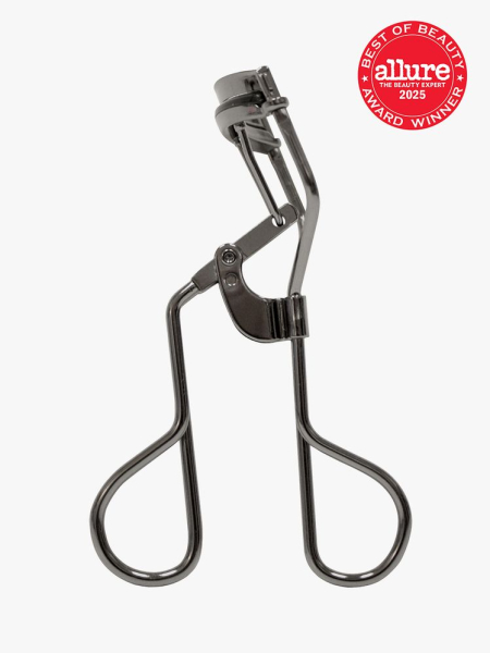 Tweezerman Pro Master Lash Curler in dark silver color way on light gray background with red Allure Best of Beauty seal in the top right corner